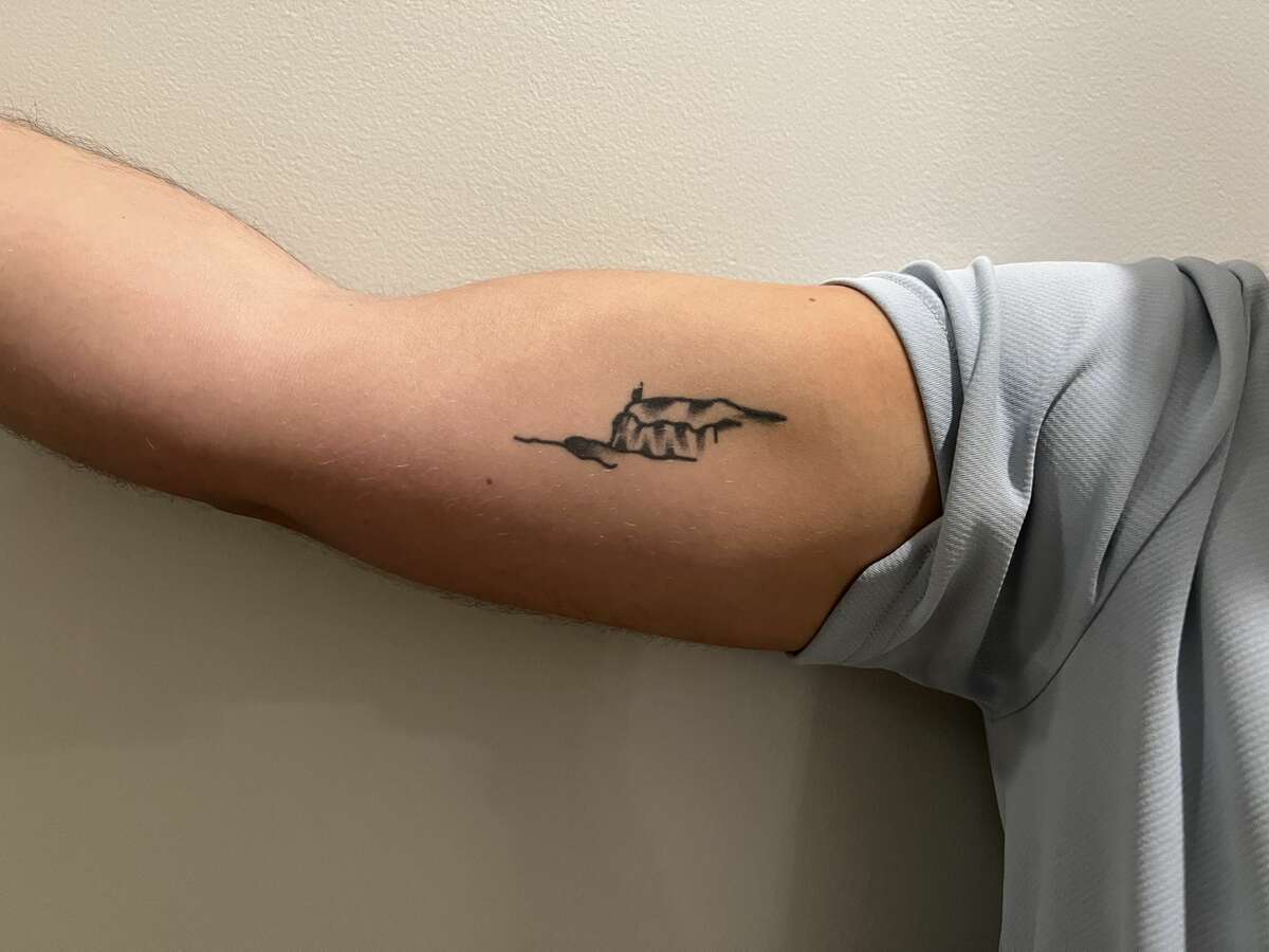 SUNY New Paltz grad Mike Ercoloni got his “Ridge” tattoo to remember his college experience and friends — his second “family for life,” he says.