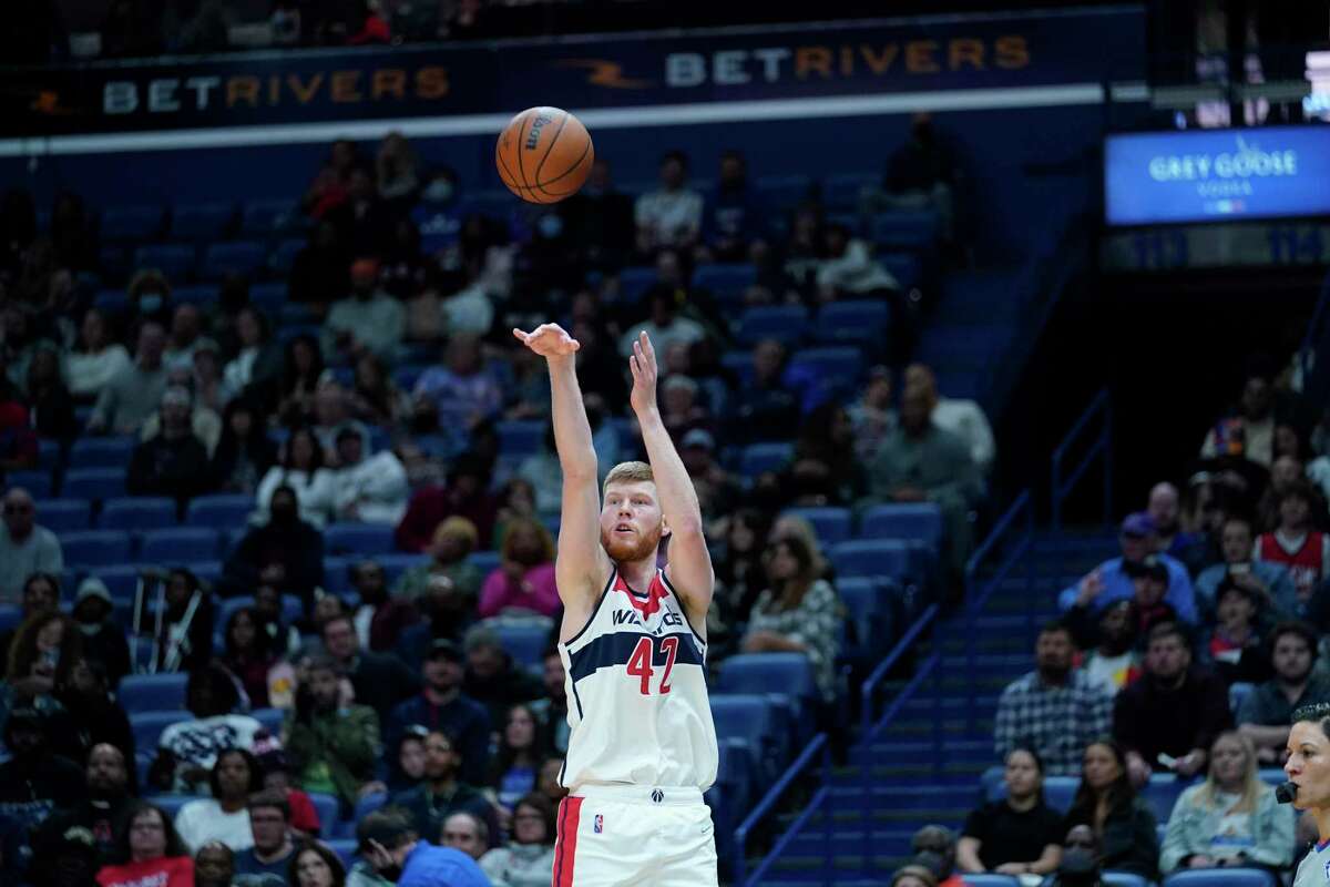 Washington Wizards forward Davis Bertans (42) shoots in the first half against the Pelicans in New Orleans on Wednesday, Nov. 24, 2021.