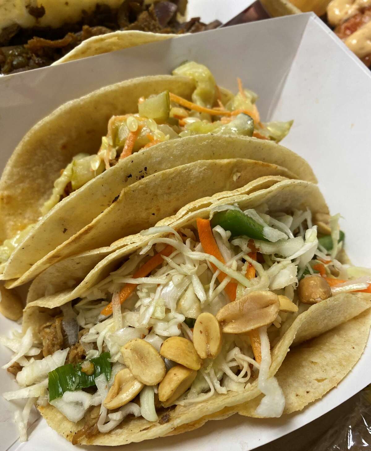 Lucky Taco’s new Vernon location offers its signature fusion-style tacos, burritos and quesadillas, with fillings like kung pao chicken (pictured), island jerk pork, Nashville hot fried chicken and Korean brisket with kimchi. 