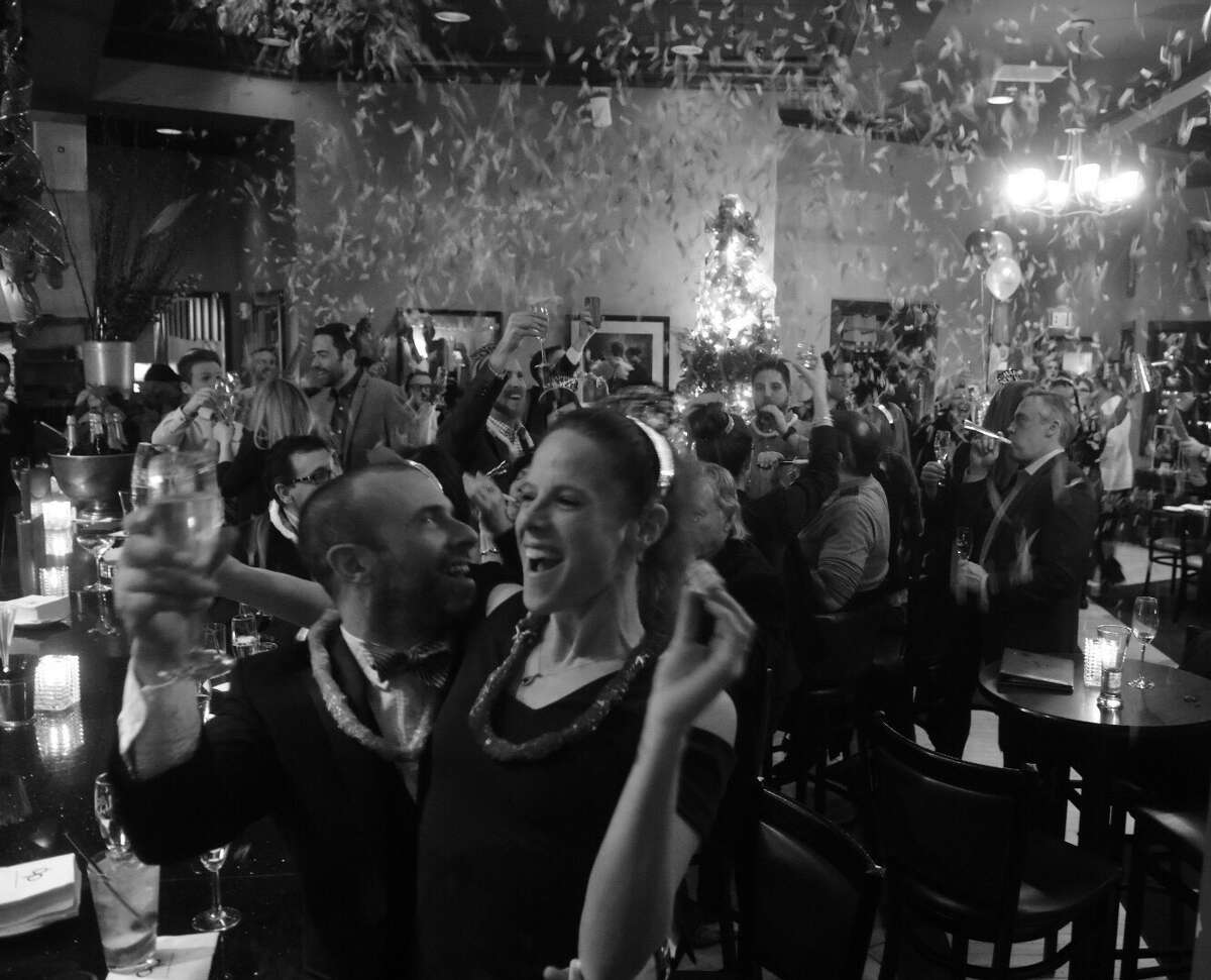 As of mid-December 2021, New Year's Eve revelers will still be allowed to ring in the new year at midnight, as shown here at dp: An American Brasserie in Albany as 2018 became 2019. Last year, Capital Region restaurants and bars had to close at 10 p.m. on New Year's Eve during a period of early closures mandated by the state in response to last year's COVID-19 resurgence. 