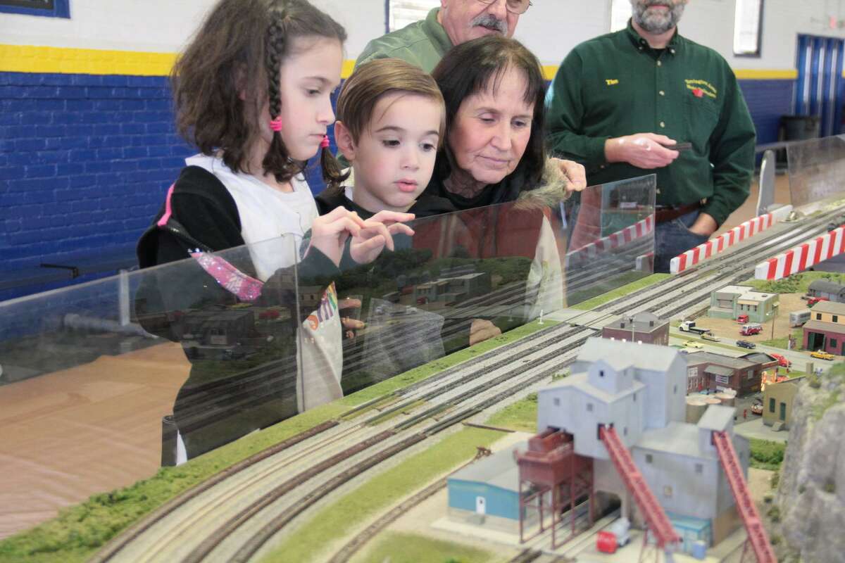 The Torrington Area Model Railroaders will hold the train show at their club building, 58 Lewis St., Torrington, from 9 a.m. to 4 p.m. Saturday and  Sunday, Dec. 3-4 and Dec. 10-11.  Admission is free, and people are asked to donate non-perishable food items for Friendly Hands Food Bank. Pictured are visitors at the 2017 show at the Torrington Armory.