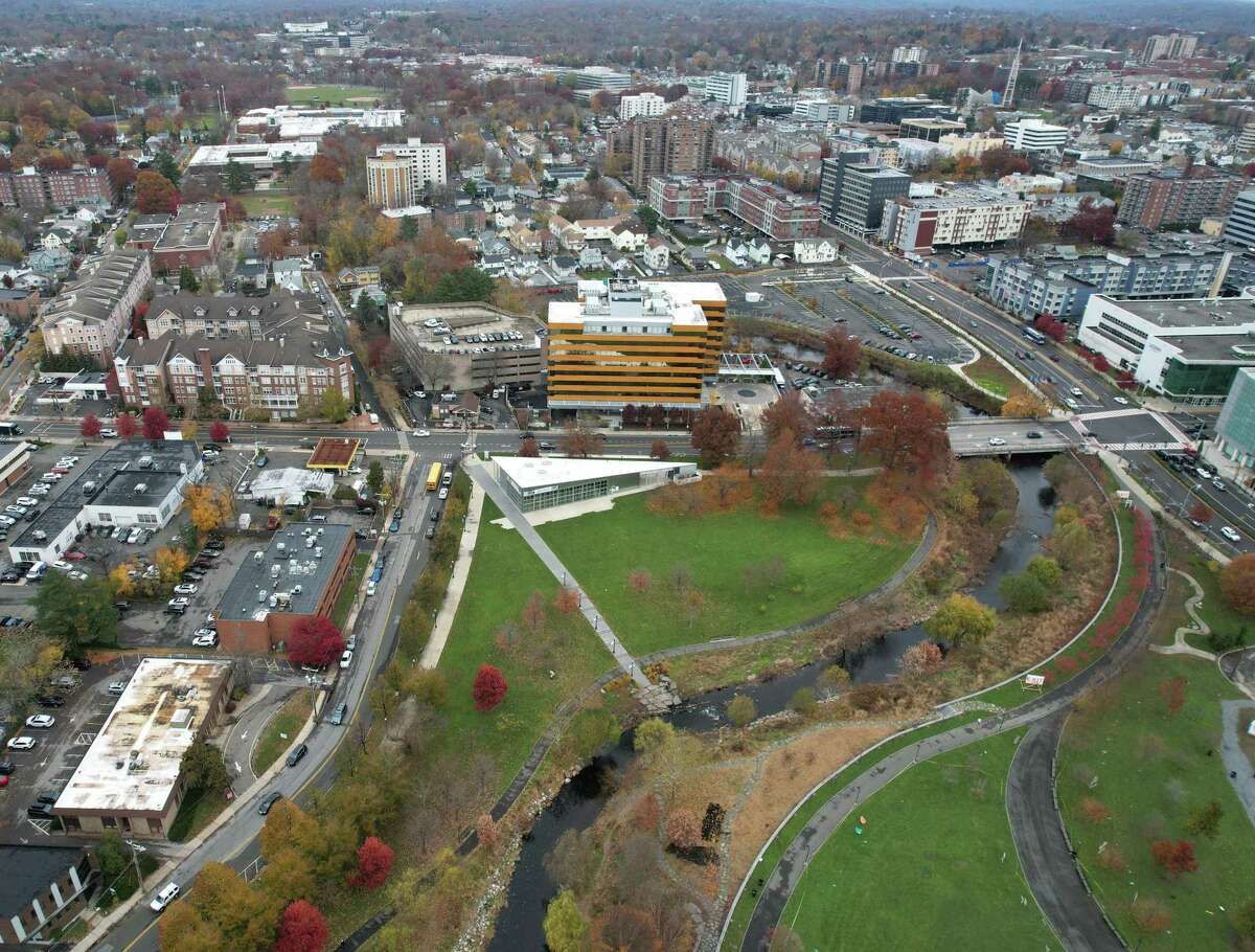 The Mill River Greenway, a walking and biking trail along Mill River, is photographed from above in Stamford, Conn. Monday, Nov. 22, 2021. The city just unveiled Phase II of the project, which will extend from the northwest corner of Mill River Park up Hanrahan Street on a winding path all the way up to Scalzi Park, shown at the top of this photo.