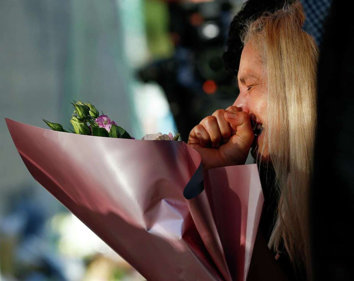 Maria de los Angeles Peña cried as she dropped off flowers at the memorial for Astroworld Festival victims outside NRG Park on Monday, Nov. 29, 2021, in Houston. Her son, 23-year-old Rodolfo “Rudy” Peña, was one of the victims from the crowd surge at the festival.