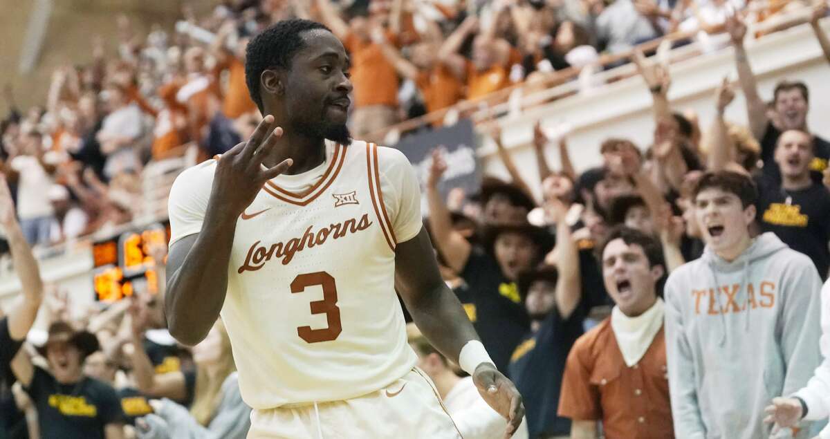 Texas guard Courtney Ramey (3) celebrates a score against Sam Houston State during the second half of an NCAA college basketball game, Monday, Nov. 29, 2021, in Austin, Texas. (AP Photo/Eric Gay)