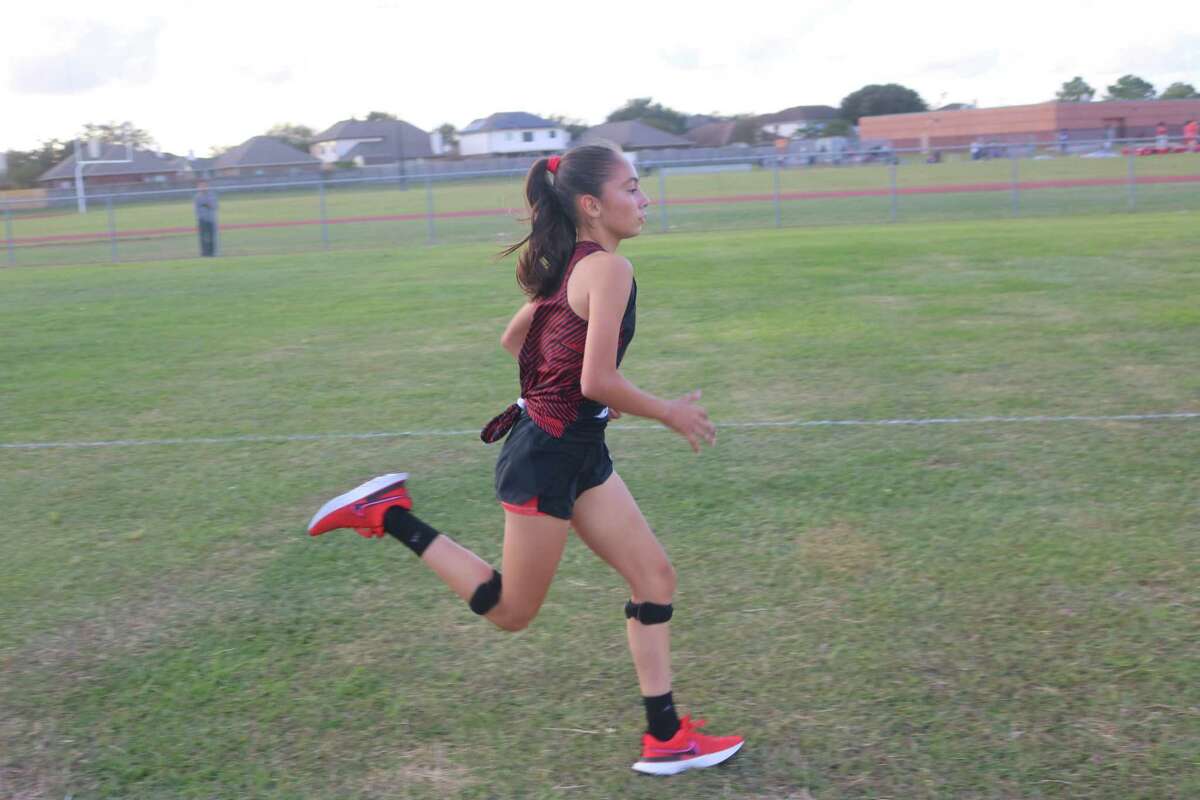A San Jacinto Intermediate runner heads for the finish line in the final tune-up race at Memorial High School on Nov. 10. The Lady Tigers dominated the eighth-grade scene, winning two titles five days later.