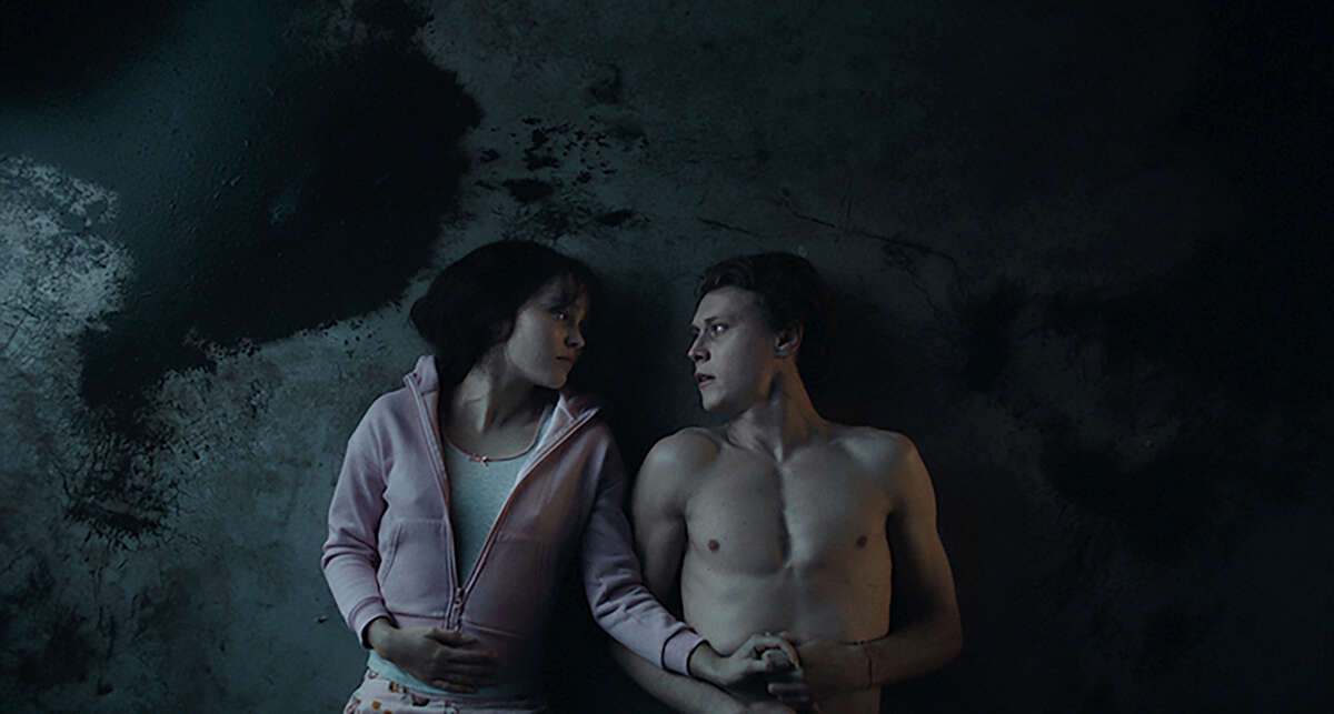 Lily-Rose Depp, left, and George MacKay in "Wolf."
