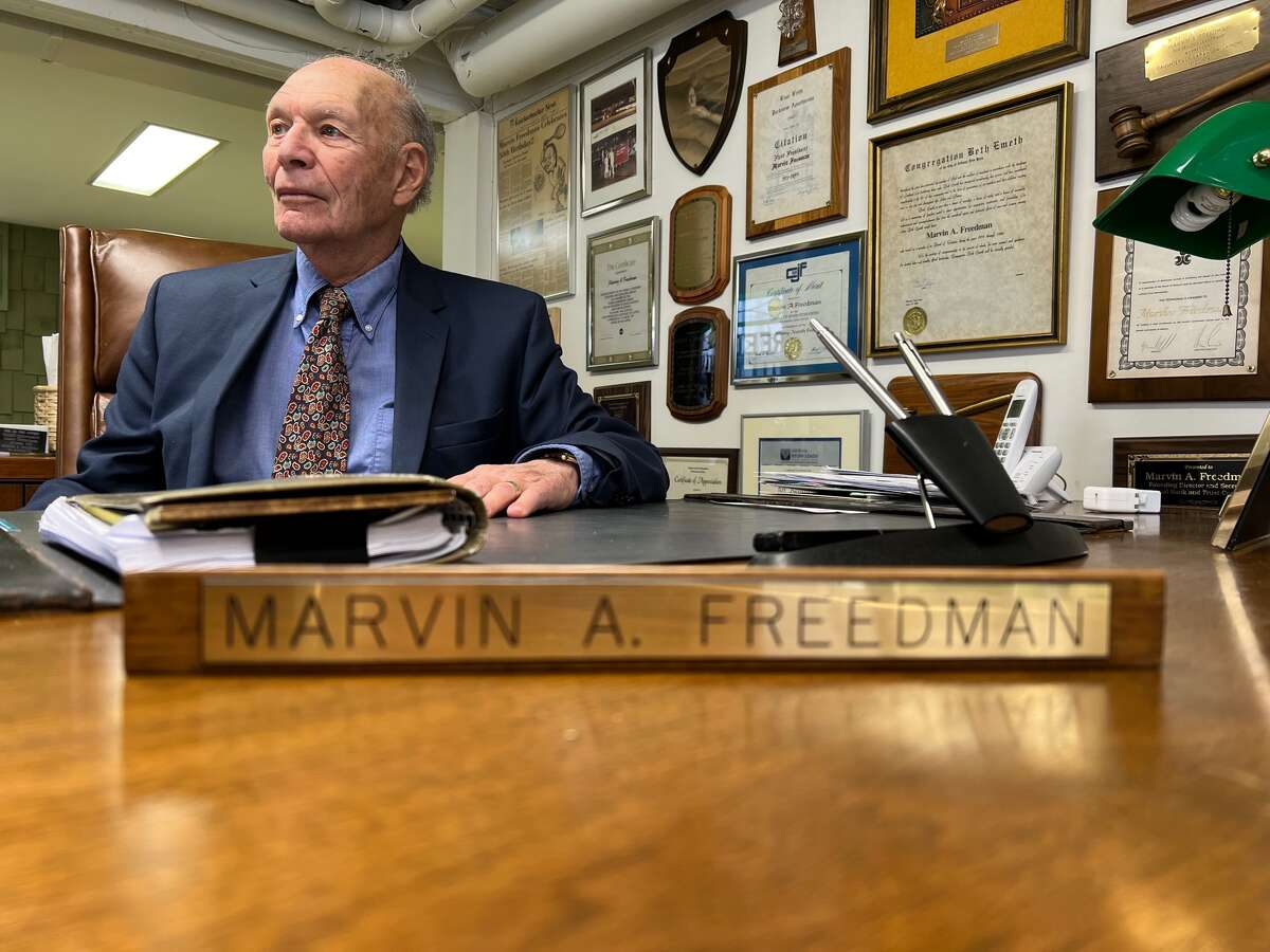Marvin Freedman, 91, is retiring on Dec. 31 after 70 years in the insurance business and five decades running the Anchor Agency. Here he is in his basement office  in Colonie. 