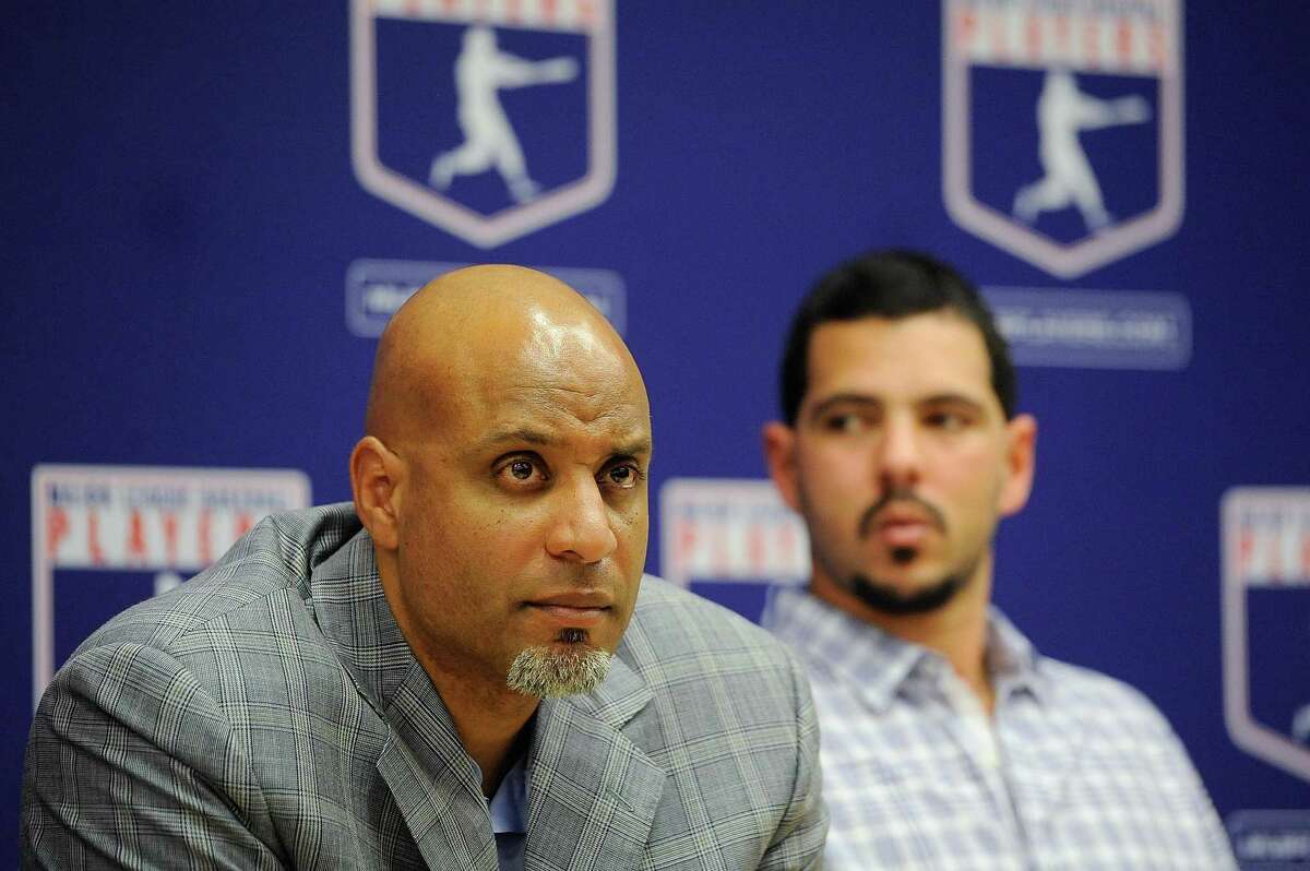 Tony Clark, left, and Carlos Villanueva during a news conference at MLB headquarters on Nov. 22, 2011, in New York.