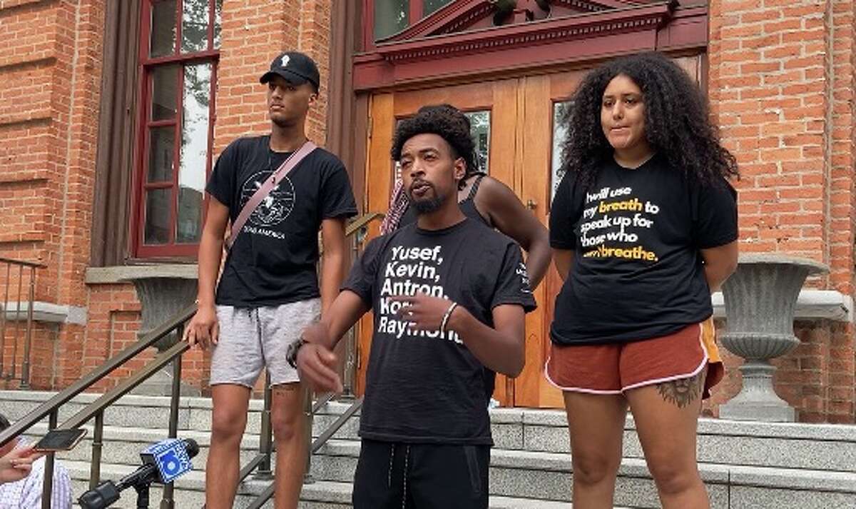 From left, TJ Sangare, Lexis Figuereo and Samira Sangare, all of whom were arrested by Saratoga Springs police, talk about their efforts for police reform on the steps of Saratoga Springs City Hall on July 6, 2021. This was just days before the July 14 protest that resulted in five arrests and a dozen weeks later. TJ Sangare appeared in court on Tuesday. His charges of unlawful imprisonment and disorderly conduct will be dismissed.