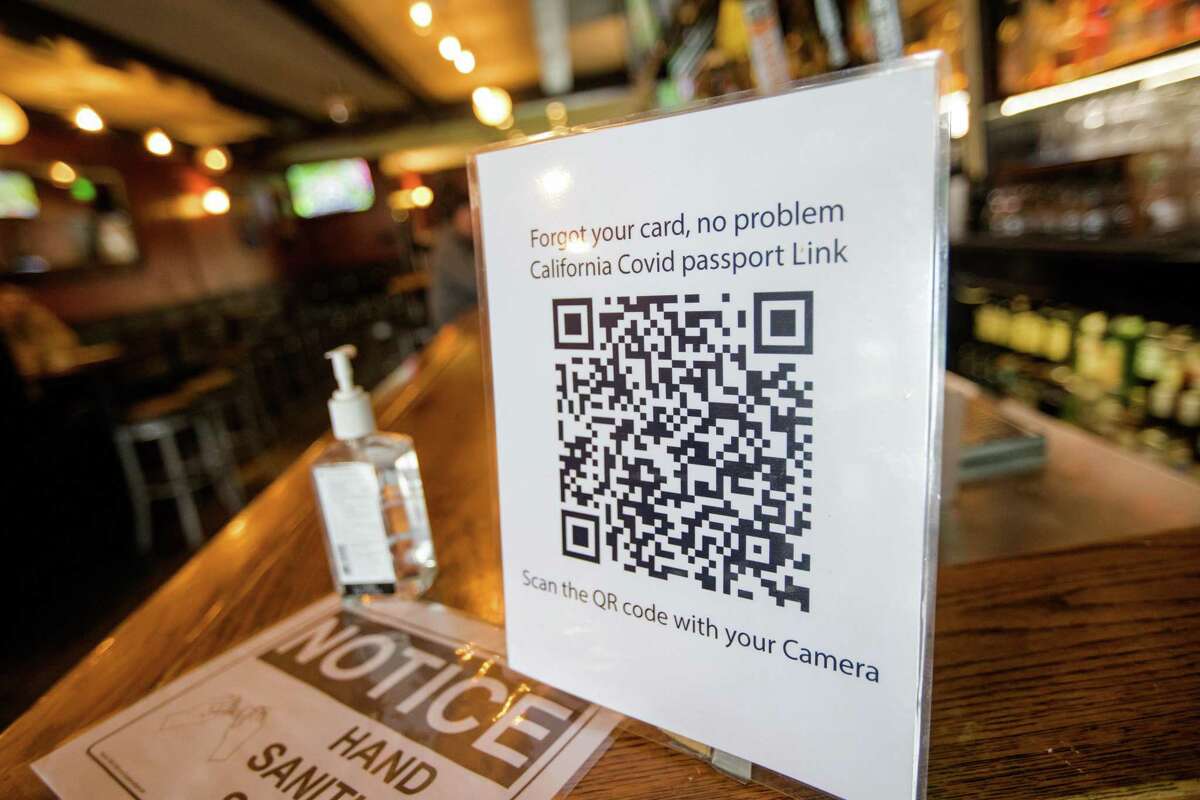 A sign reminds customers entering a California restaurant to show proof of vaccination. While more than 141,000 people have accessed their online COVID records in Connecticut since the program launched last month, it’s unknown how many are using it as proof of vaccination.