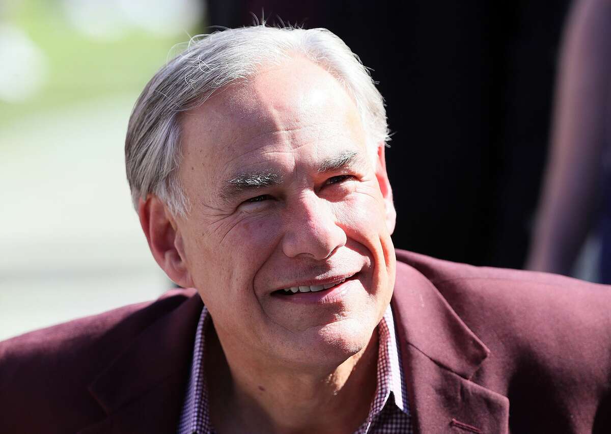 Texas governor Greg Abbott on the field before the Texas A&M Aggies take on the Auburn Tigers at Kyle Field on November 06, 2021 in College Station, Texas.