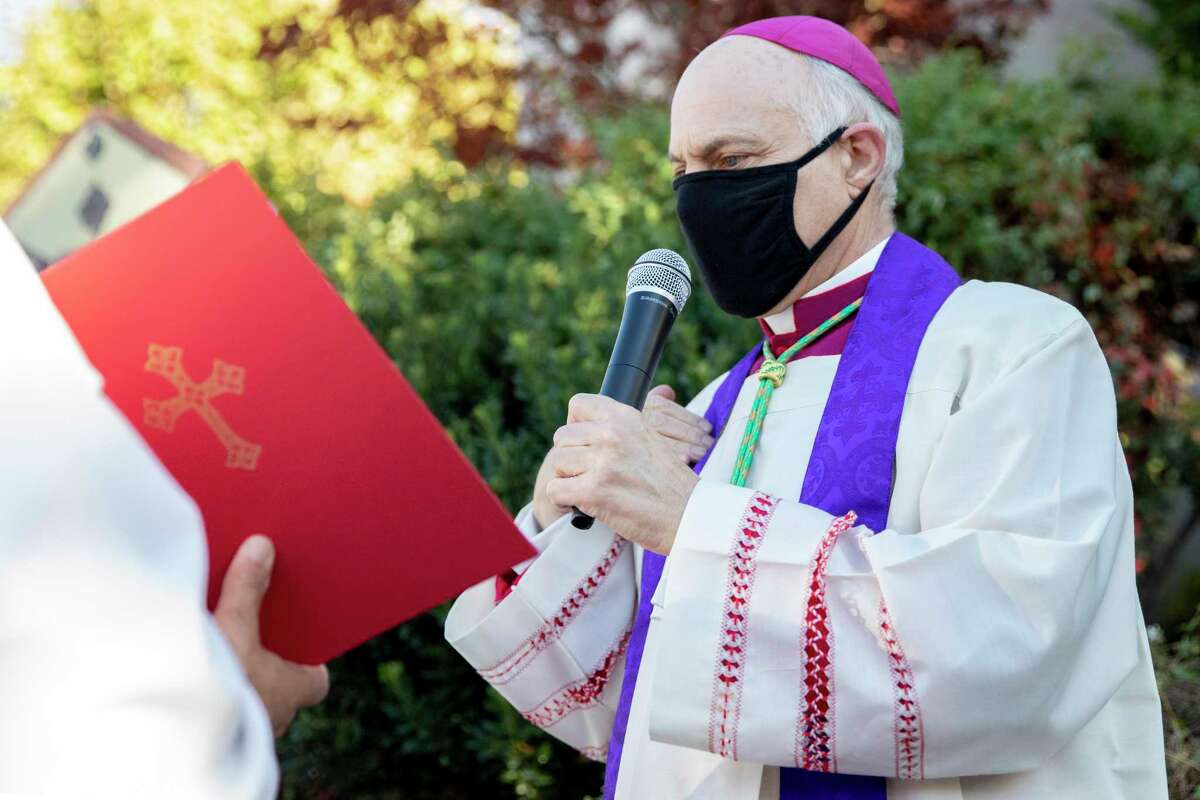 San Francisco Archbishop Salvatore Joseph Cordileone conducts an exorcism outside of Church of Saint Raphael in San Rafael, Calif. on Oct. 17, 2020, on the spot where a statue of St. Junipero Serra was toppled during a protest.