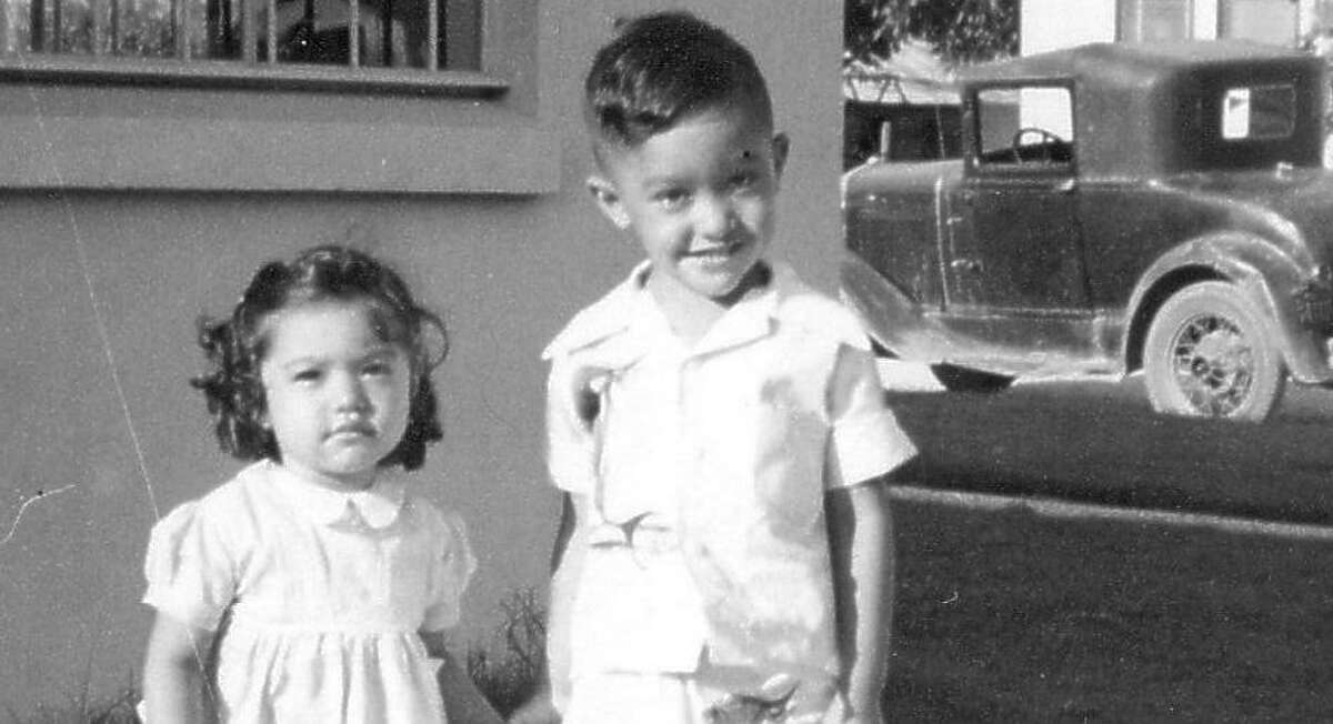 Henry Cisneros and his sister Pauline at their grandfather’s business, Mungia Print Shop, in 1951. Cisneros is one of the notable native Texans interviewed in the book “Growing Up in the Lone Star State.”