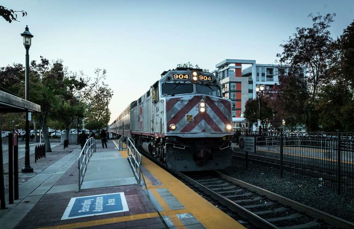 A southbound train pulls into Caltrain Sequoia Station Shopping Center in Redwood City. The 12-acre property anchored by Safeway is the focus of a major redevelopment plan.