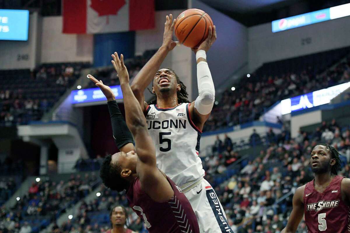 UConn’s Isaiah Whaley, right, shoots over Maryland-Eastern Shore’s Donchevell Nugent in the first half of Tuesday’s game in Hartford.
