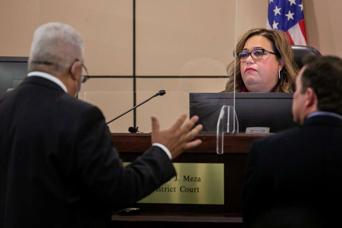 State District Judge Velia Meza listens to defense attorney Demetrio Duarte speak alongside prosecutor Clayton Haden at a plea hearing Tuesday for Melissa Peoples, accused of intoxication manslaughter for killing Dr. Naji Kayruz in 2019.