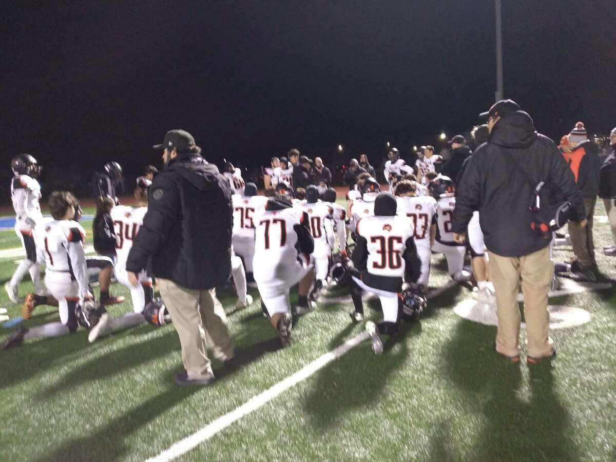 Shelton football celebrates a 42-28 win at Hall in the CIAC Class LL quarterfinals on Nov. 30, 2021, in West Hartford, Conn.