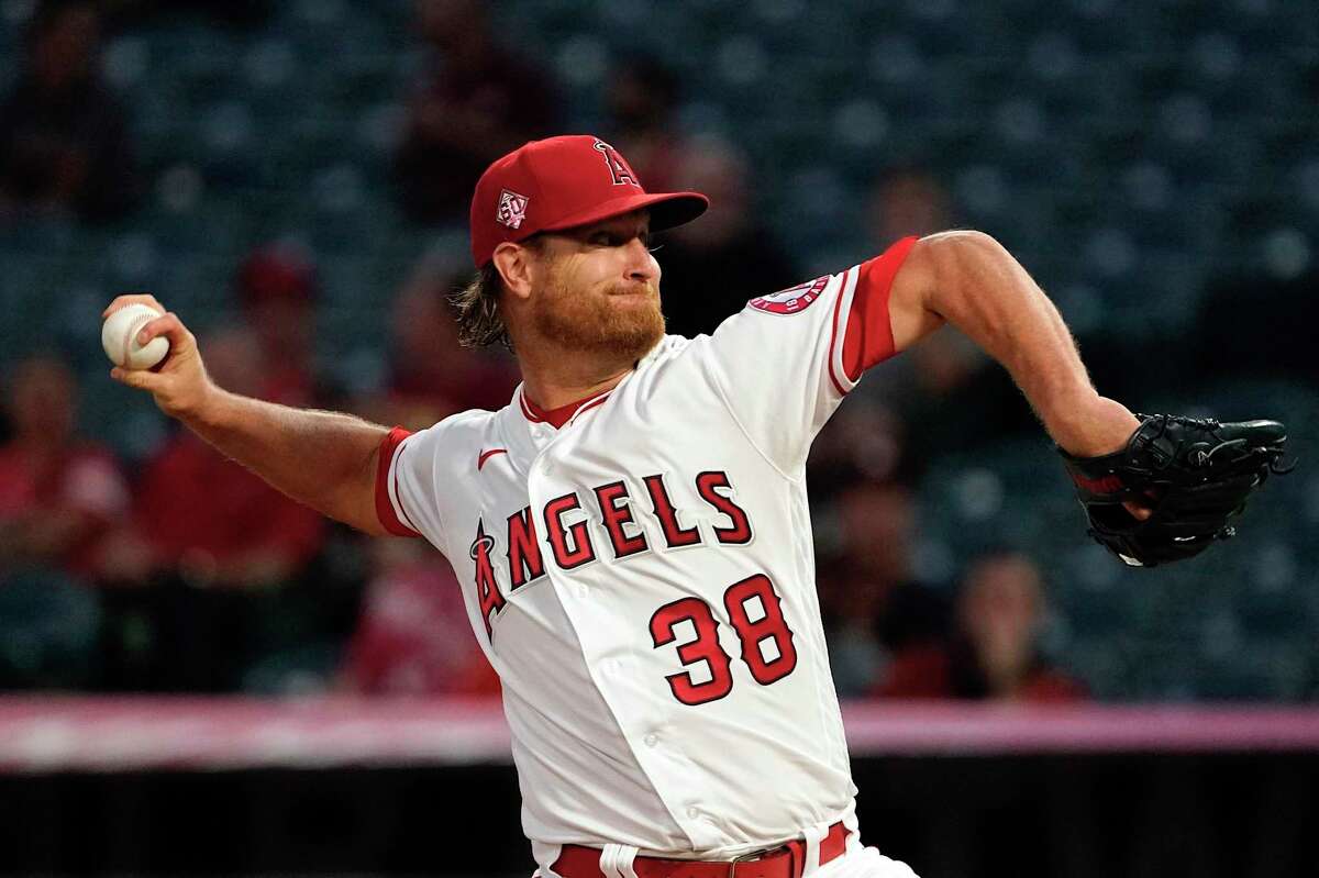 FILE - Los Angeles Angels starting pitcher Alex Cobb throws to the plate during the first inning of a baseball game against the Houston Astros Thursday, Sept. 23, 2021 in Anaheim, Calif. Right-hander Cobb is close to finalizing an agreement with the San Francisco Giants, a person with direct knowledge of the negotiations said Monday, Nov. 29, 2021. The person spoke on condition of anonymity because Cobb still must pass a physical to complete the deal. (AP Photo/Mark J. Terrill, File)