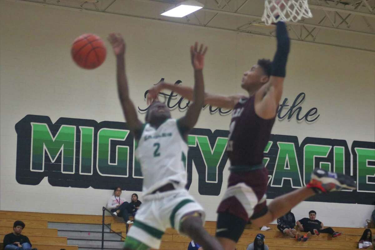 A Wildcat takes to the air to block a Kyedan Smith shot. Smith was Pasadena's leading scorer with 23 points, but he was limited to six second-half points because of defense like this.