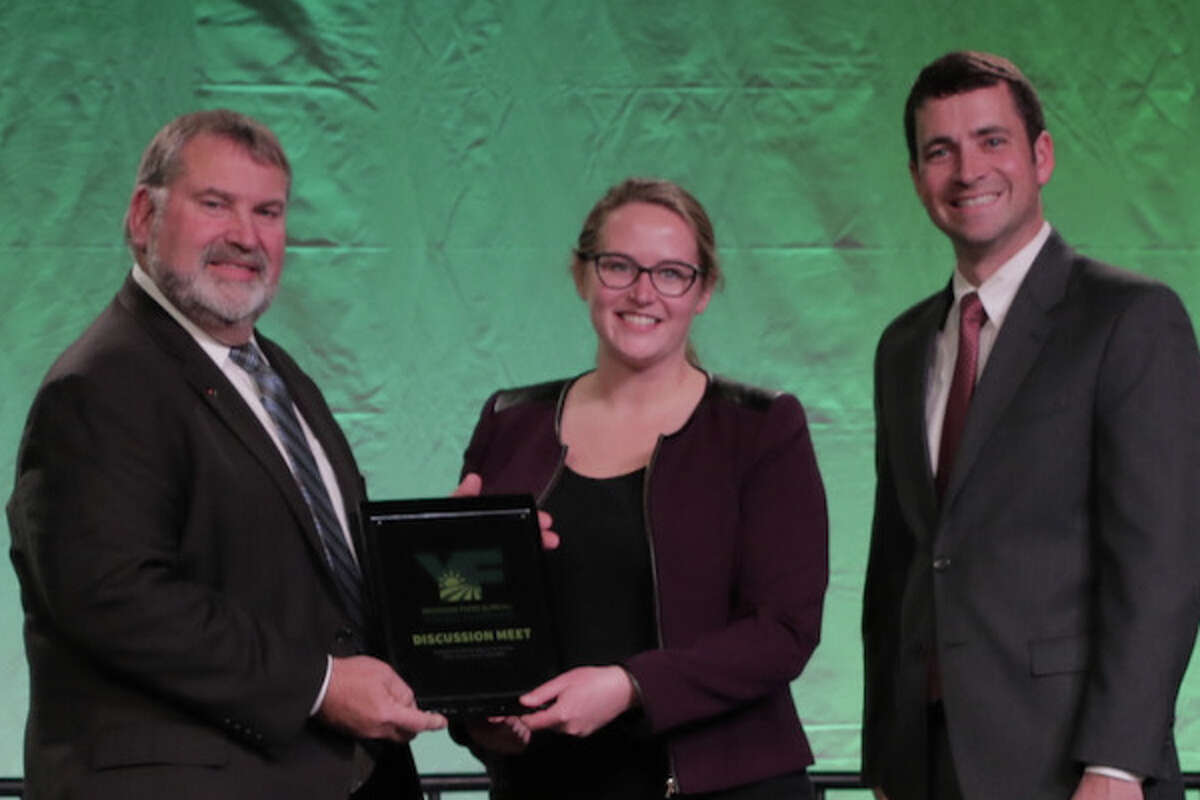 State Young Farmer Discussion Meet Winner Sarah Zastrow, flanked by MFB President Carl Bednarski (left)and State Young Farmer Chair Paul Pridgeon.