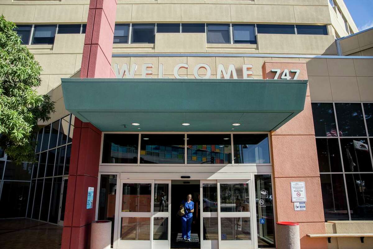 A nurse exits UCSF Benioff Children's Hospital in Oakland, Calif. The hospital will be conducting research using gene-editing technology in the hopes of putting an end to sickle cell disease.