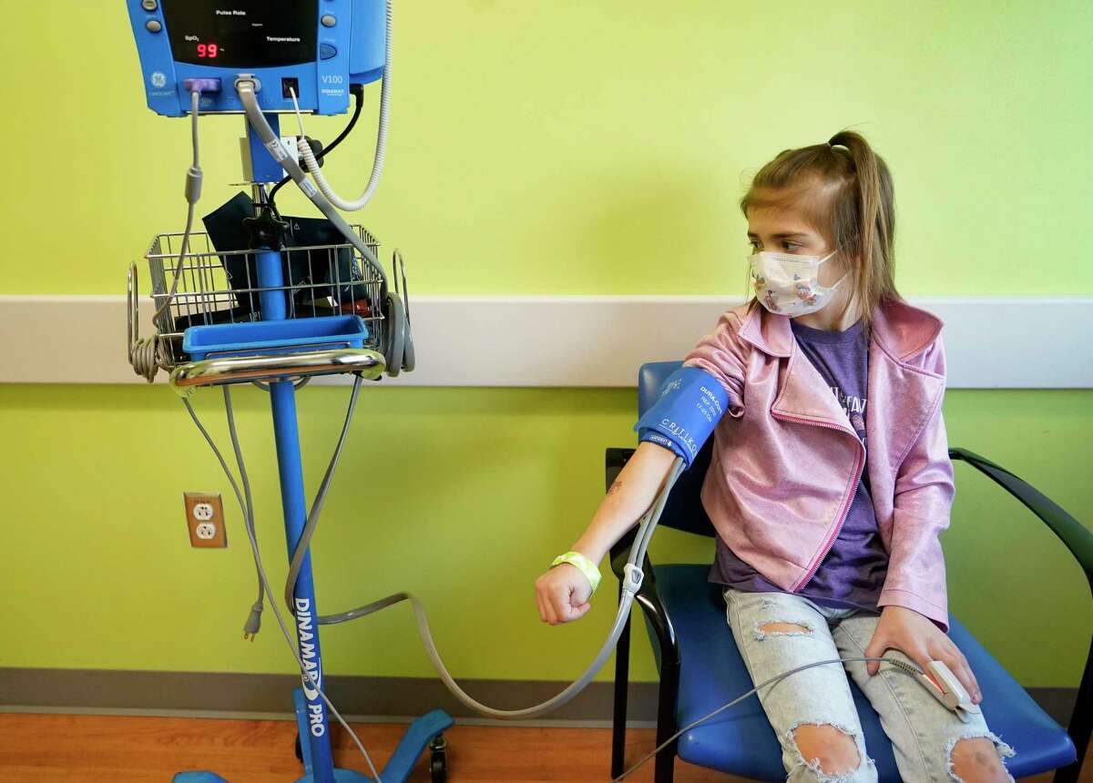 Brooklynn Wesser, 9, has her vitals taken during appointment at Texas Children's Hospital Thursday, Oct. 21, 2021 in Houston. Brooklynn was on a heart transplant list for years and received a new heart amid the historic February freeze.