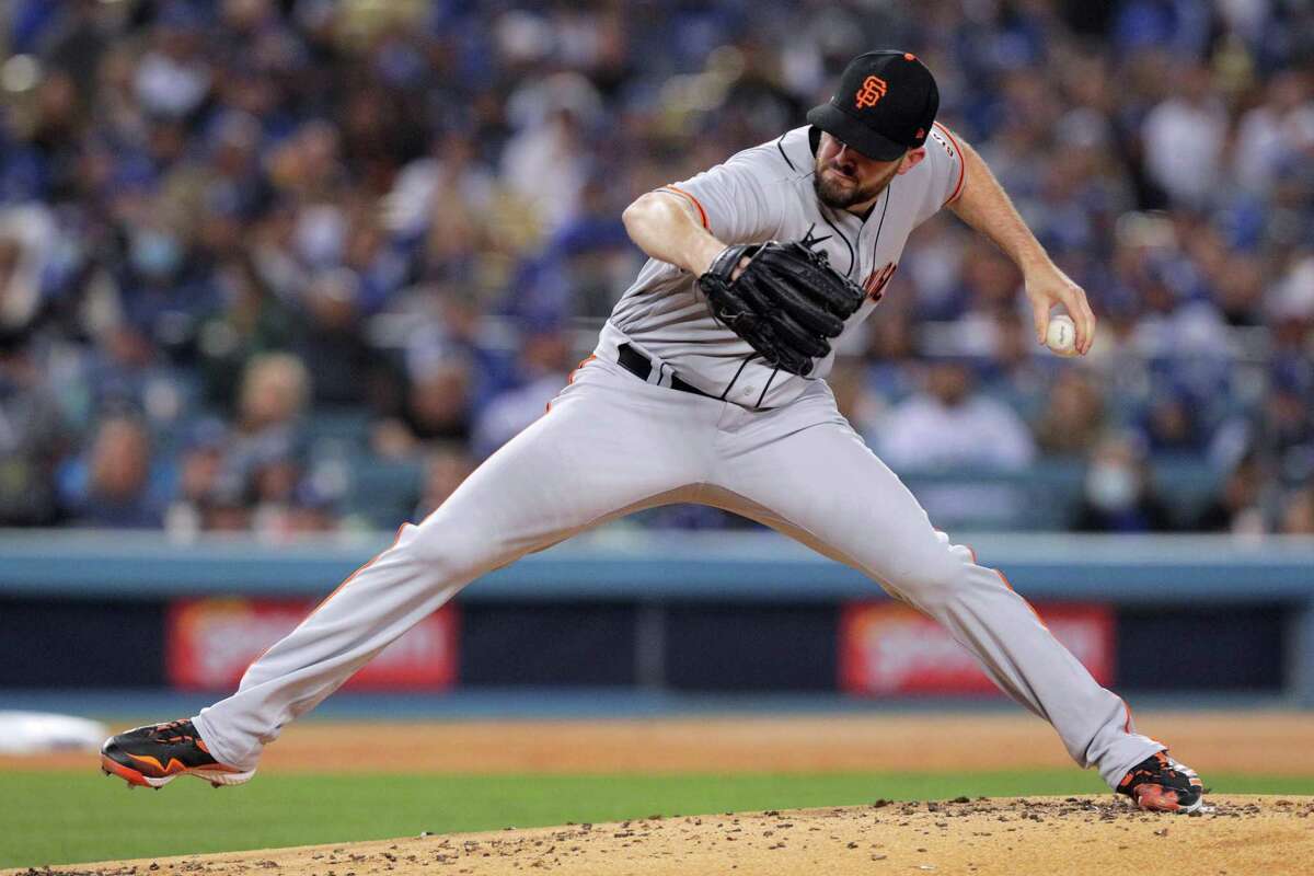 San Francisco Giants starting pitcher Alex Wood (57) throws during the first inning as the San Francisco Giants played the Los Angeles Dodgers in Game 3 of the National League Division Series at Dodger Stadium in Los Angeles, Calif. on Monday, Oct. 11, 2021.