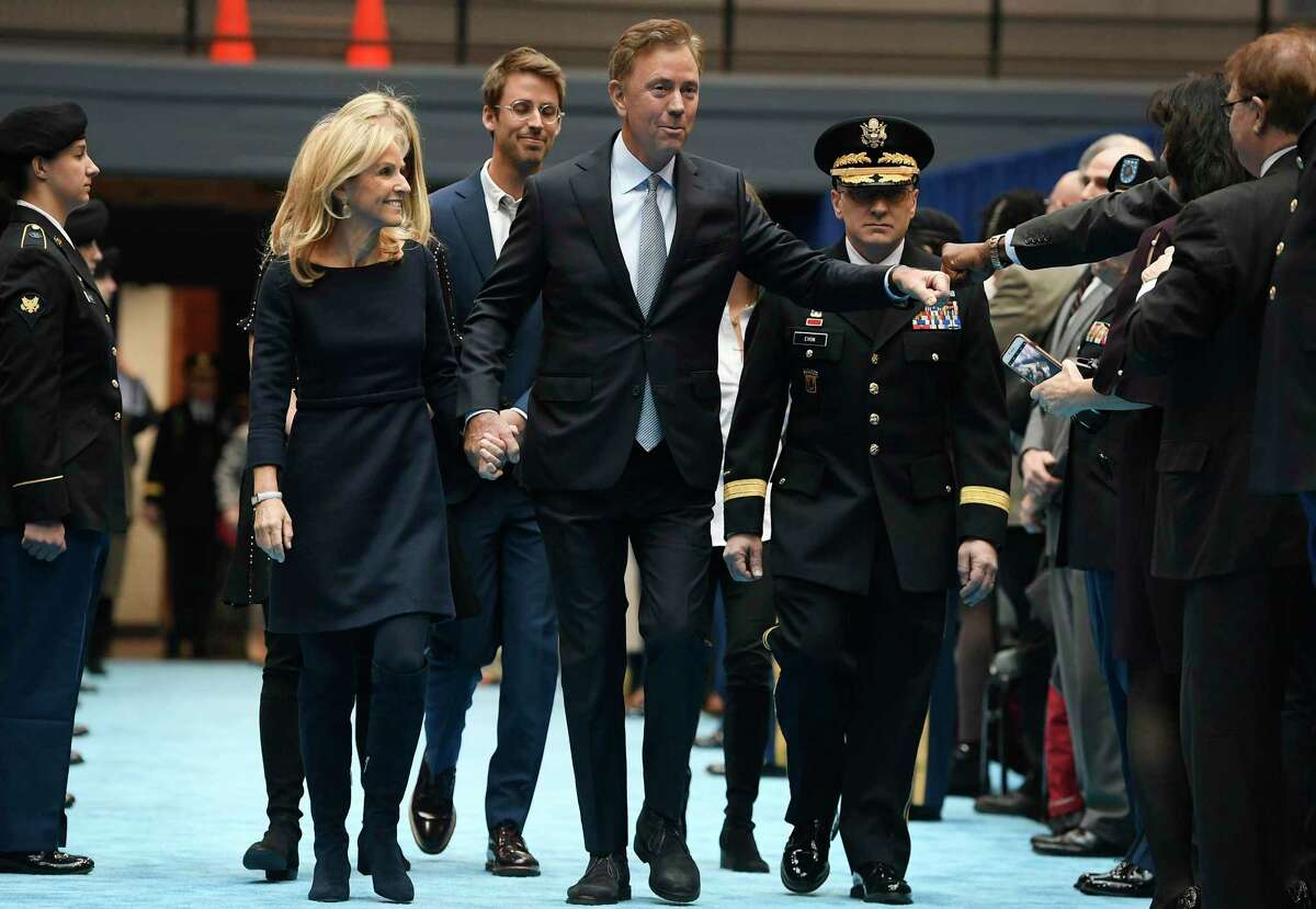 Connecticut Gov. Ned Lamont arrives with wife Annie, left, and his family for his inauguration at the William A. O'Neill Armory in Hartford Conn., Wednesday, Jan. 9, 2019. (AP Photo/Jessica Hill, Pool)