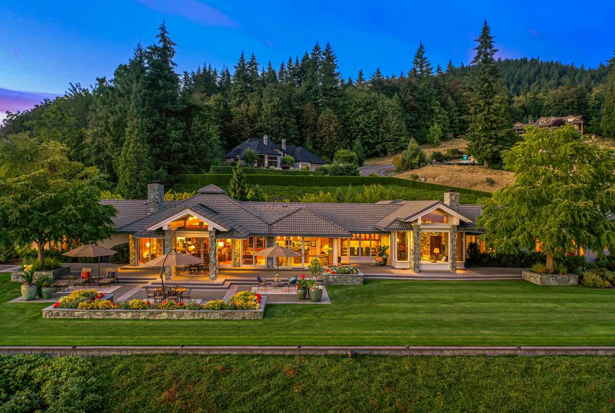 The lot is nestled below a tree line, maxing out the sense of a private estate atop the world. 