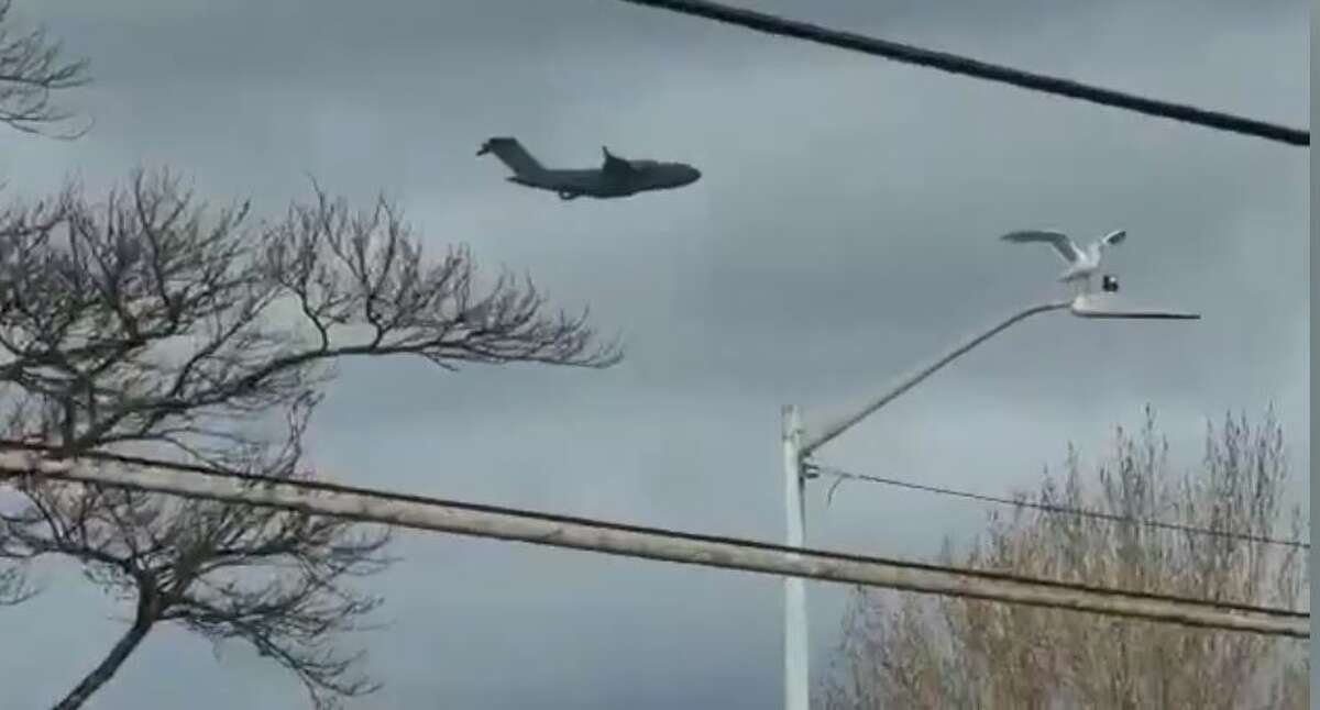 Low-flying plane seen over West Seattle on Dec. 1, 2021.