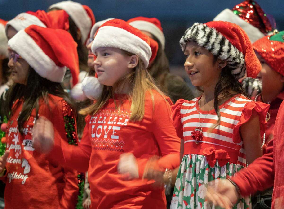 Students from Bowie Fine Arts Academy sing holiday songs as Midlanders come out on a beautiful 11/30/2021 evening in Centennial Plaza for the annual Tree Lighting. Tim Fischer/Reporter-Telegram