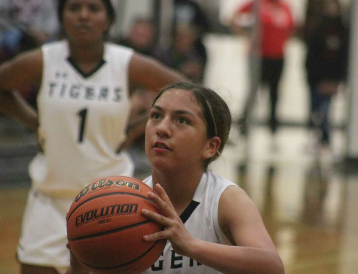 Lady Tiger Aleah Garza prepares to shoot a foul shot during second-half action Wednesday night. Garza led all scorers with 16 points. In the background is Kyeo Ayala, who tacked on 11 points.