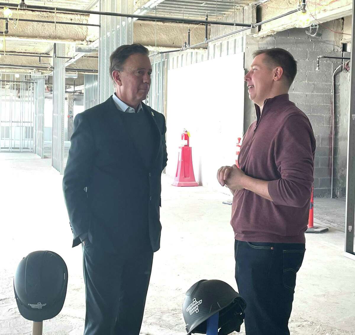 Gov. Ned Lamont, left, and Digital Currency Group founder and CEO Barry Silbert talk on Monday, Nov. 29, 2021 at the future DCG headquarters at 290 Harbor Drive in Stamford, Conn.