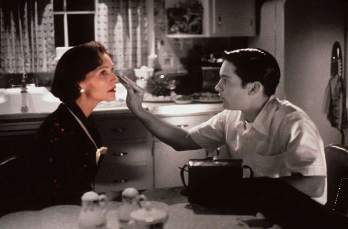 Tobey Maguire reaches out to touch the face of actress Joan Allen in this scene from New Line Cinema's film “Pleasantville.” The inventive, optimistic movie tells the story of a black-and-white 1950s-era TV town that turns to color when a pair of 1990s teens arrive.