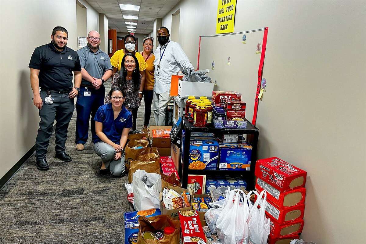The CFISD psychological services and community programs departments partnered together to collect 2,021 items during the annual “Turkey Trot Food Donation Race” to provide needed food items to the district’s food pantry. Pictured are representatives from the two departments alongside youth service specialists. The food drive is psychological services’ annual community outreach project and the department partnered with community programs.