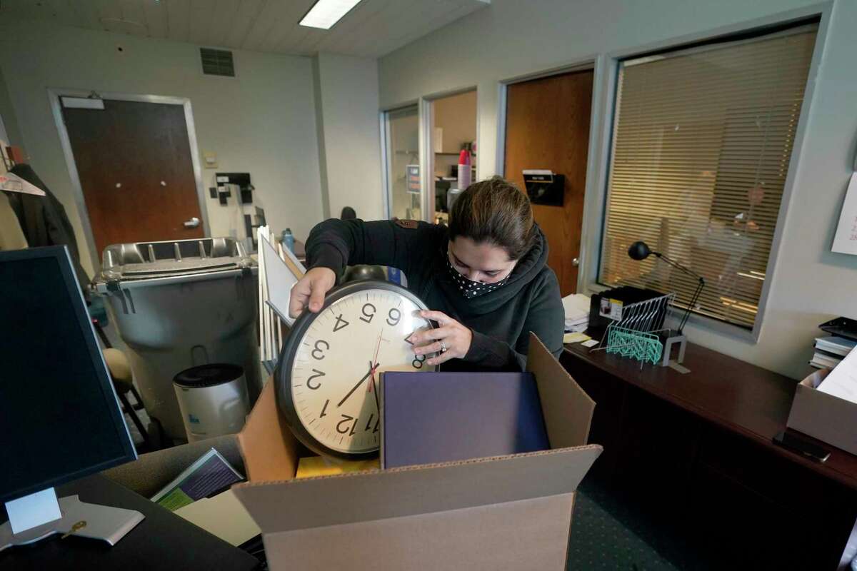 Gina Frisby, chief of staff for Assemblyman Evan Low, D-San Jose, packs boxes at Low’s Capitol Annex office in Sacramento, Calif., on Nov. 29, 2021. The Annex will be demolished and replaced with a more modern building that complies with building codes. For now, lawmakers and staff are clearing out their offices to move to a newly constructed office building two blocks away from the Capitol.