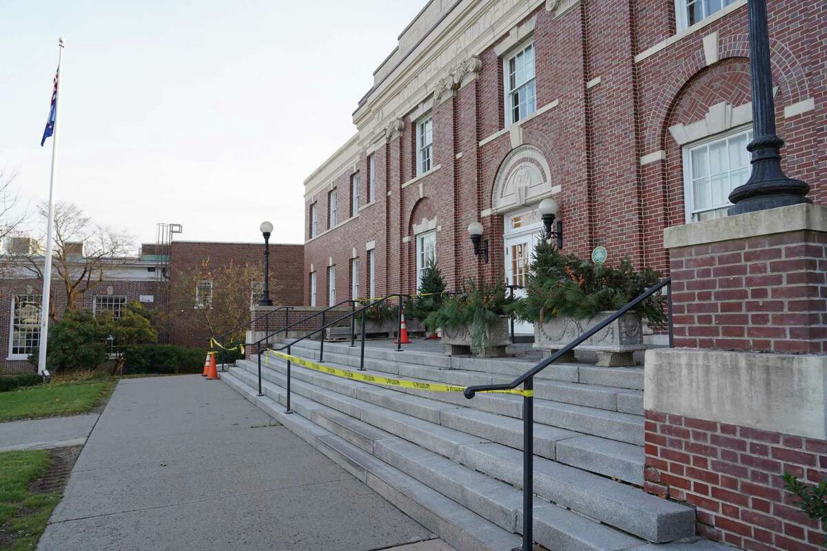 Caution tape has been hung around the 50-foot wide steps in the front of New Canaan Town Hall. The seven steps may need to be taken out after an inspection to resolve drainage issues revealed the steps and the platform were built on sand and not concrete.