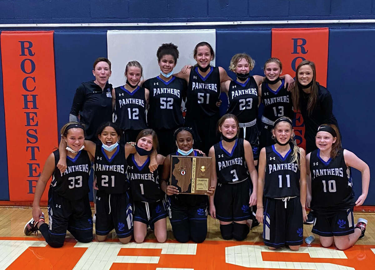 In this file photo, the Liberty Middle School seventh-grade girls basketball team poses with the Sectional 8 championship on Wednesday in Rochester. 