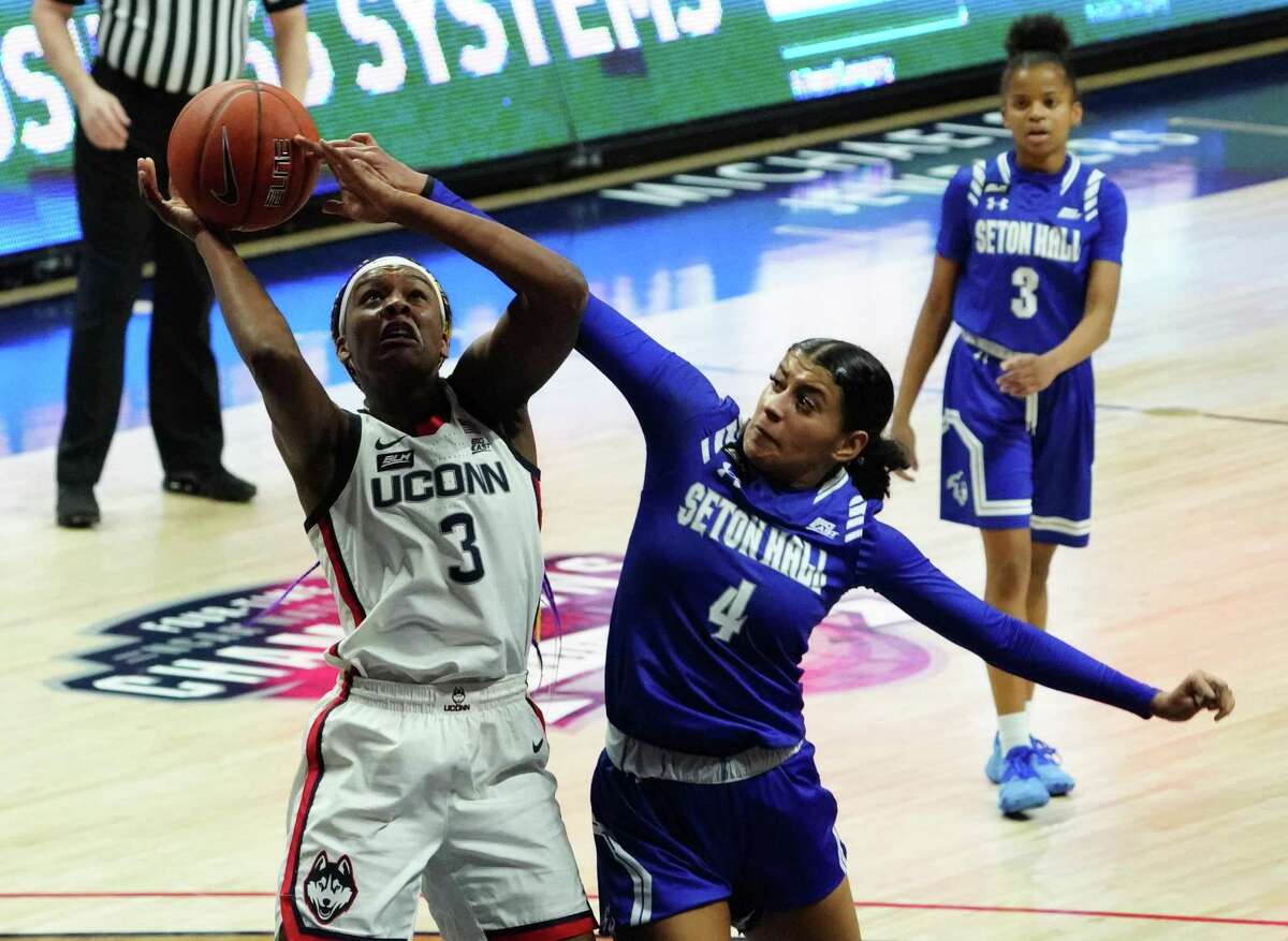 Seton Hall Pirates guard Andra Espinoza-Hunter (4) defends against UConn Huskies forward Aaliyah Edwards (3) in the second half at Harry A. Gampel Pavilion on Feb. 10. UConn defeated Seton Hall 70-49.