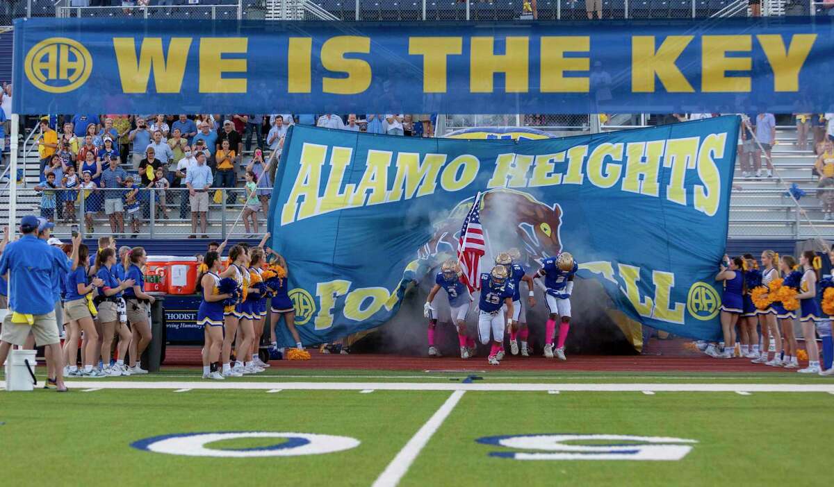 The Alamo Heights football team enters the field Friday, Oct. 8, 2021 before the start of their homecoming game against Floresville.