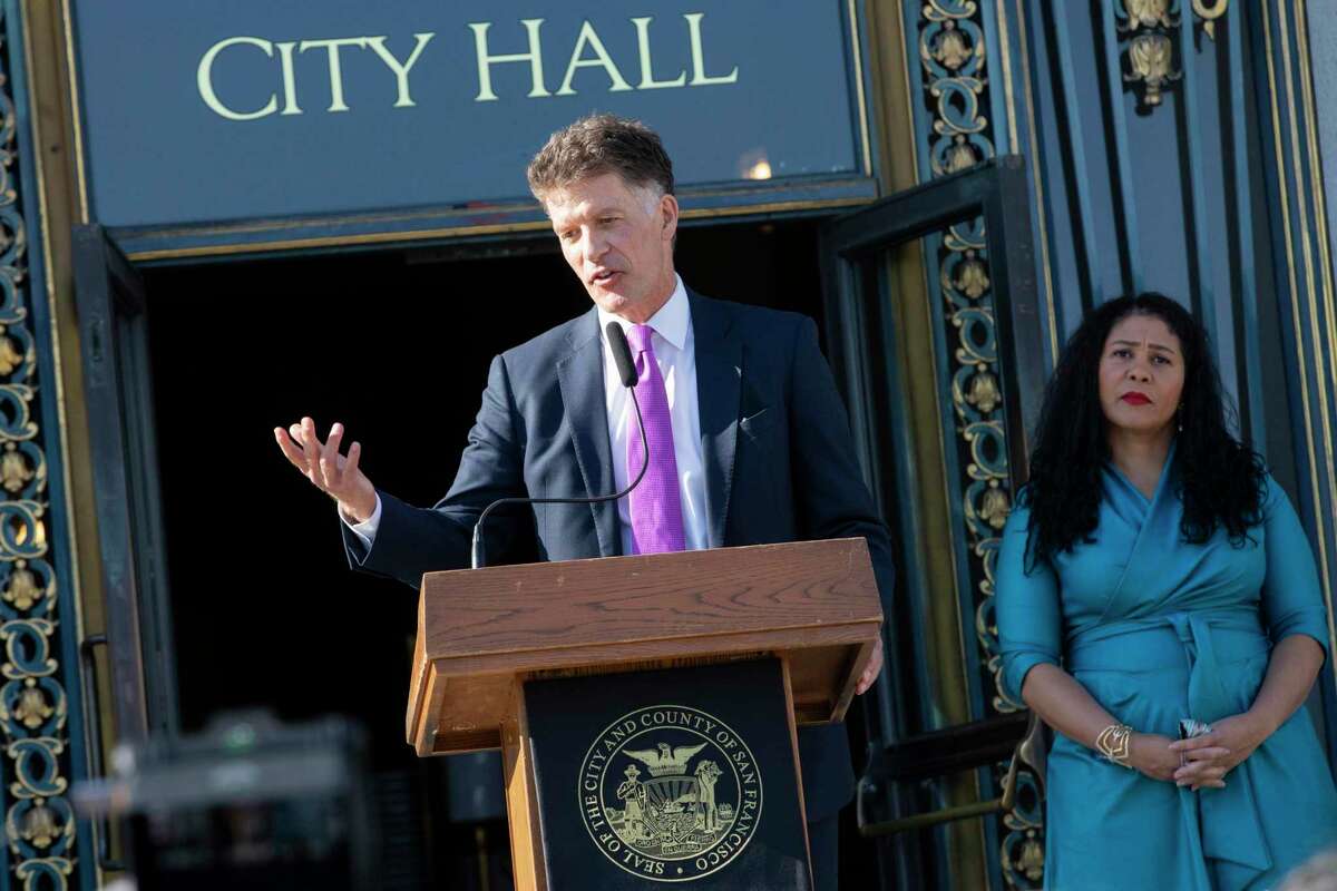 San Francisco health director Dr. Grant Colfax and S.F. Mayor London Breed announce the nation’s first case of the omicron variant at City Hall on Wednesday.