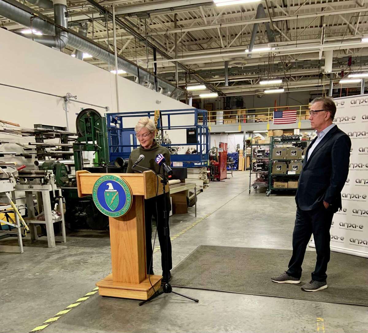 U.S. Secretary of Energy Jennifer M. Granholm speaks about a new grant to reduce greenhouse emissions in the gas, oil and coal industries Thursday, Dec. 2, 2021, at Precision Combustion in North Haven, while Gov. Ned Lamont stands alongside.