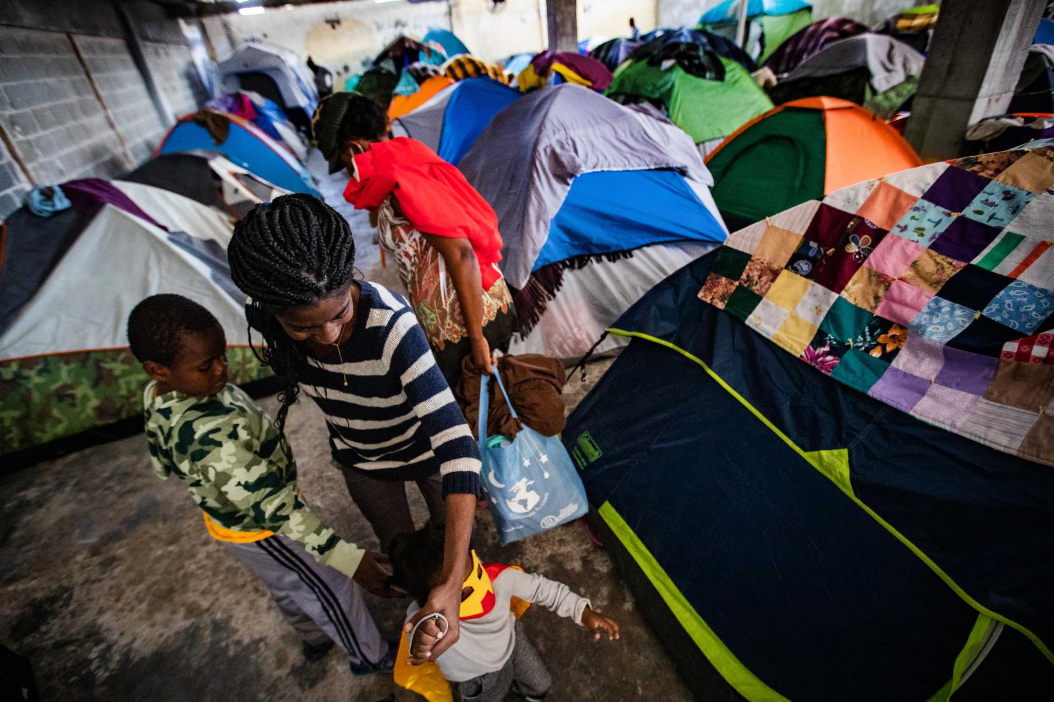 Haitians begin a new life in Mexico, as a makeshift border shelter near ...