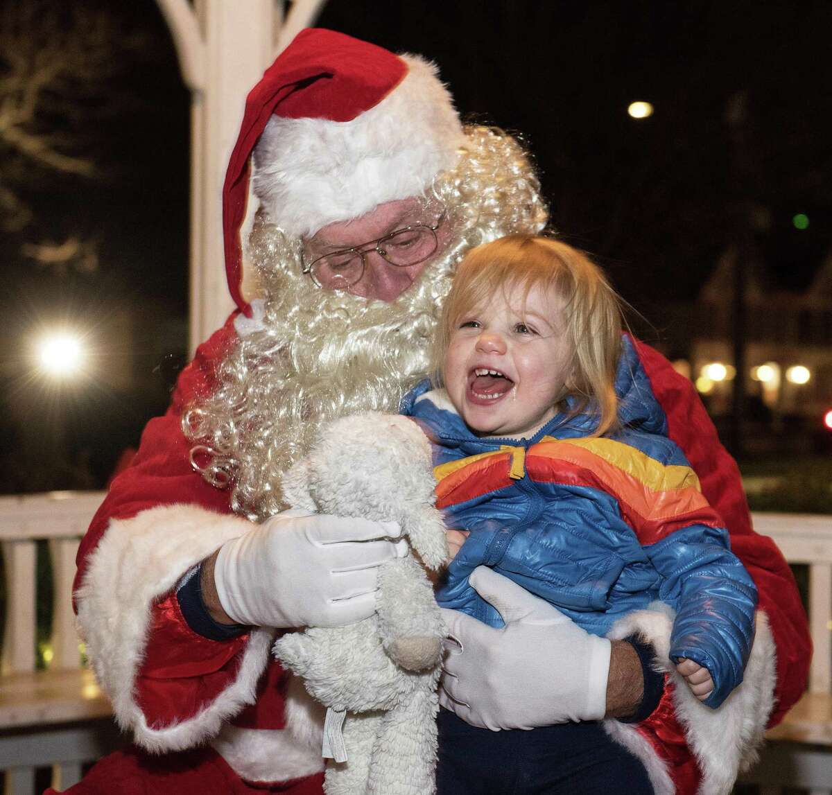 Francine Schwartz, 2, and her stuffed companion previously have a chat with Santa Claus at the annual Holiday Stroll event in Wilton Center, in a recent year. One of the upcoming happenings with the Wilton Library is a Stroll to the Library event from 5:30 to 7 p.m., on Friday, Dec. 3.