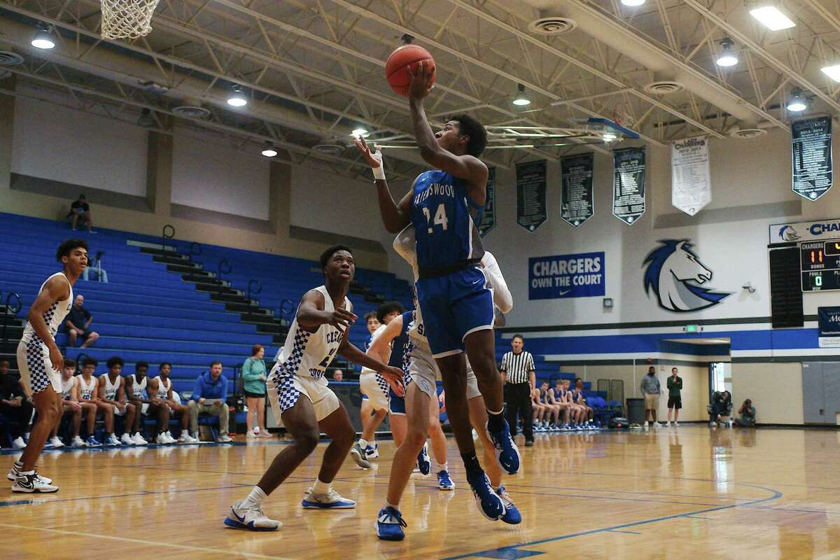 Friendswood’s Adam Buffington (24) lays up a shot against Clear Springs.