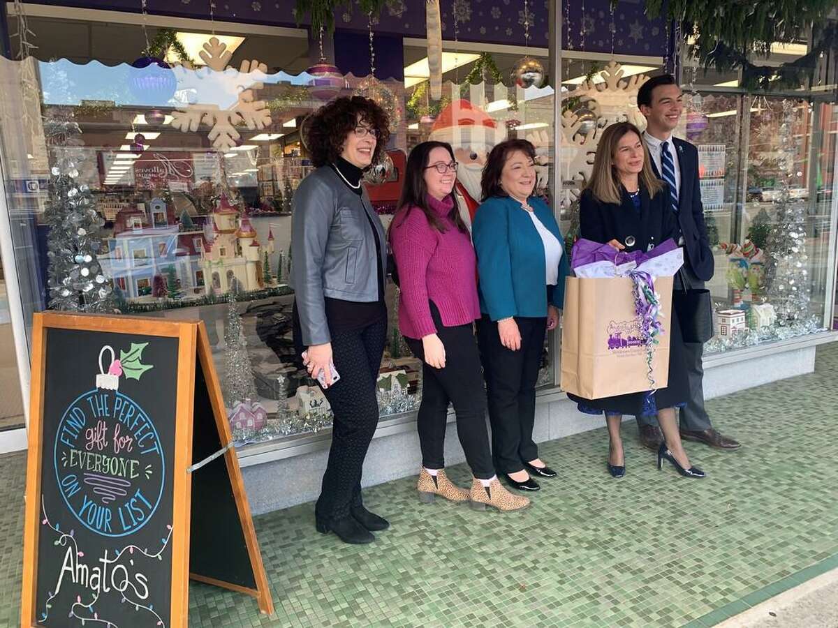 From left, Downtown Business District Coordinator Sandra Russo-Driska, Amato’s Toy and Hobby co-owner Caroline Gervais and her mother, co-owner Diane Gervais, Lt. Gov. Susan Bysiewicz and Middletown Mayor Ben Florsheim pose for a photograph after touring several local businesses Thursday. They were there to encourage the public to shop local during the holidays as Small Business Saturday approaches.