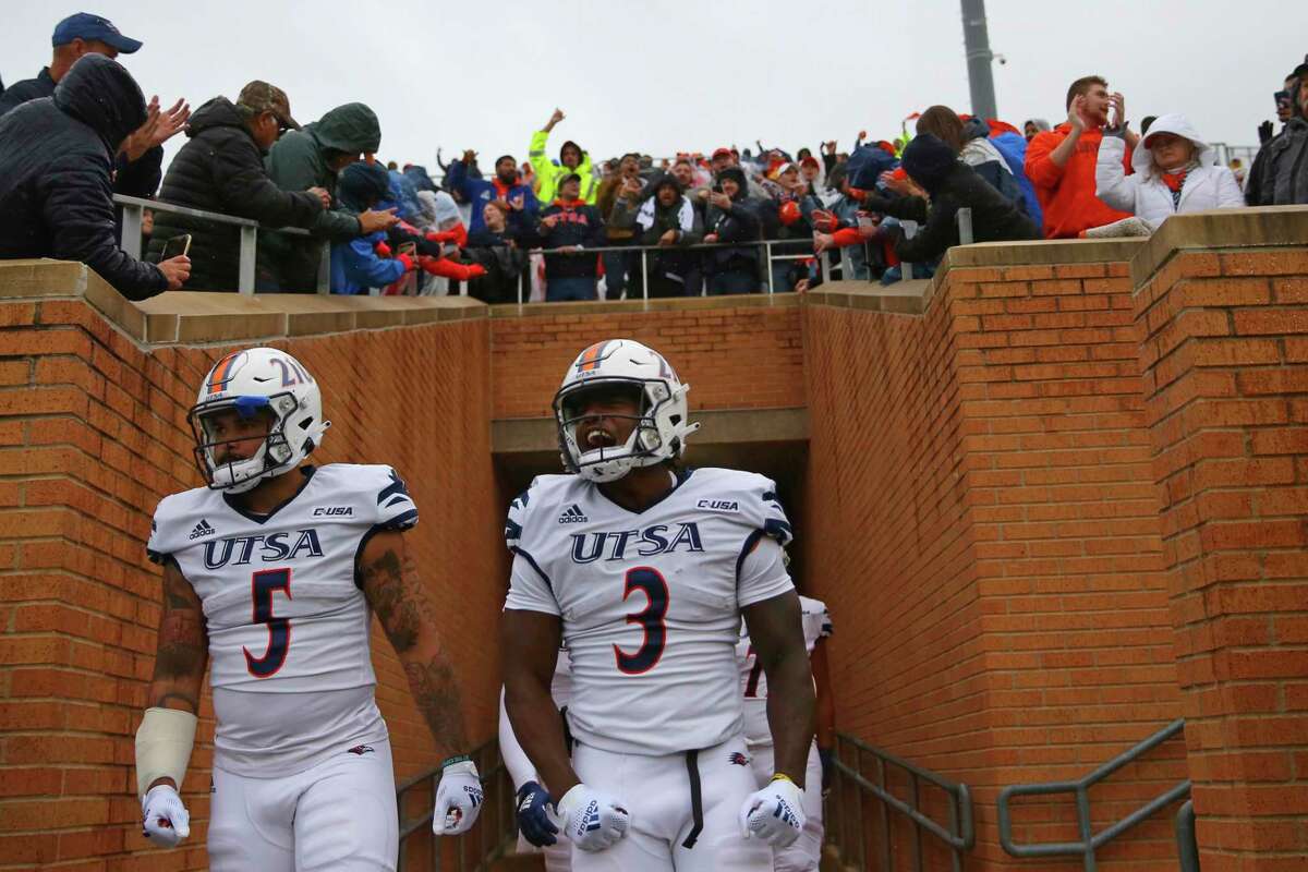 UTSA players enter the field before the first half of an NCAA college football game against North Texas in Denton, Texas, Saturday, Nov. 27, 2021.