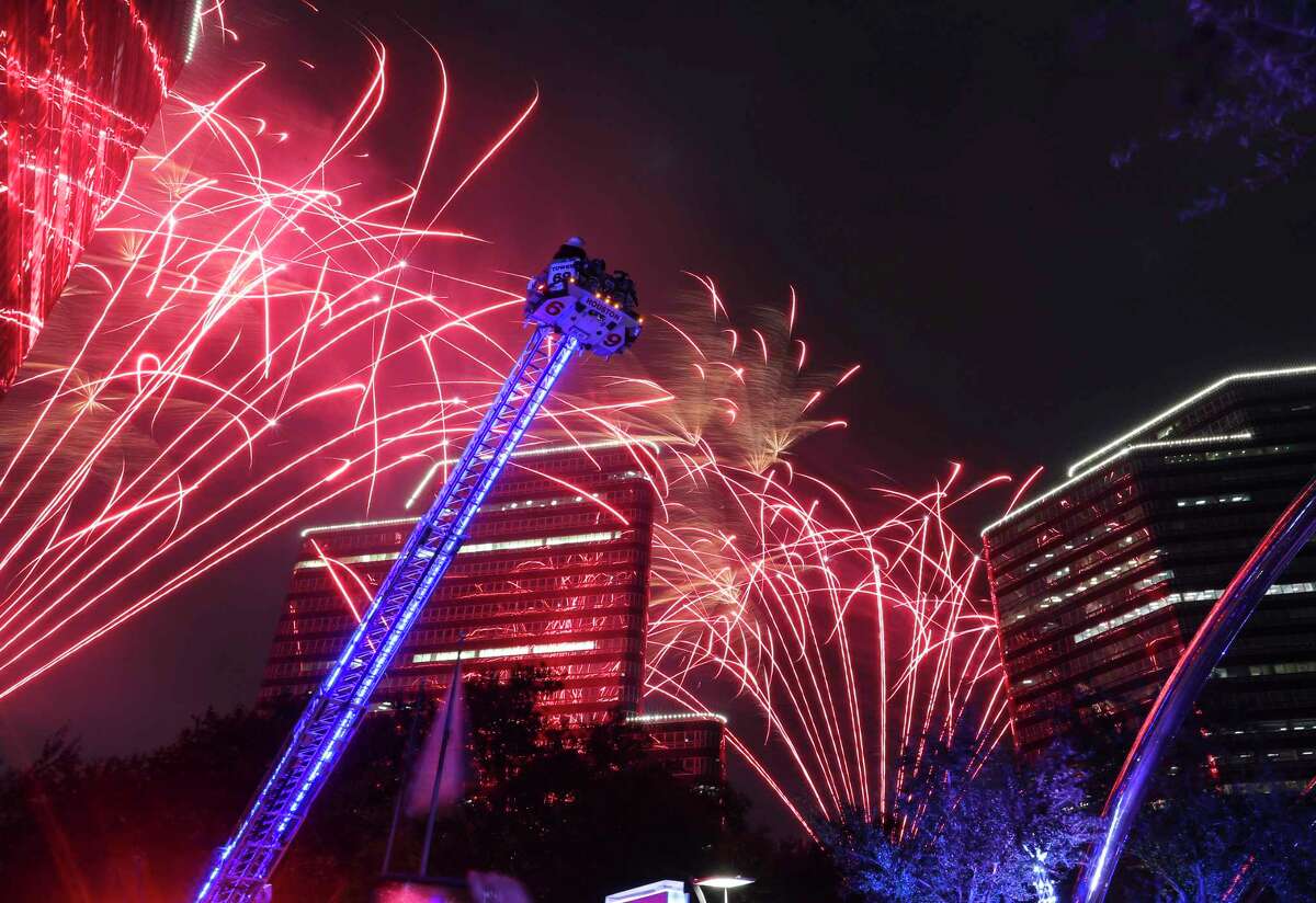 Santa on a Houston ladder truck as the fireworks lit up the sky during the 33rd Annual Uptown Holiday Lighting on Nov. 25, 2021, along Post Oak in Houston. Nearby Loop 610 northbound will close at 9 p.m. Dec. 3 for a weekend of work, complicating trips into Uptown.