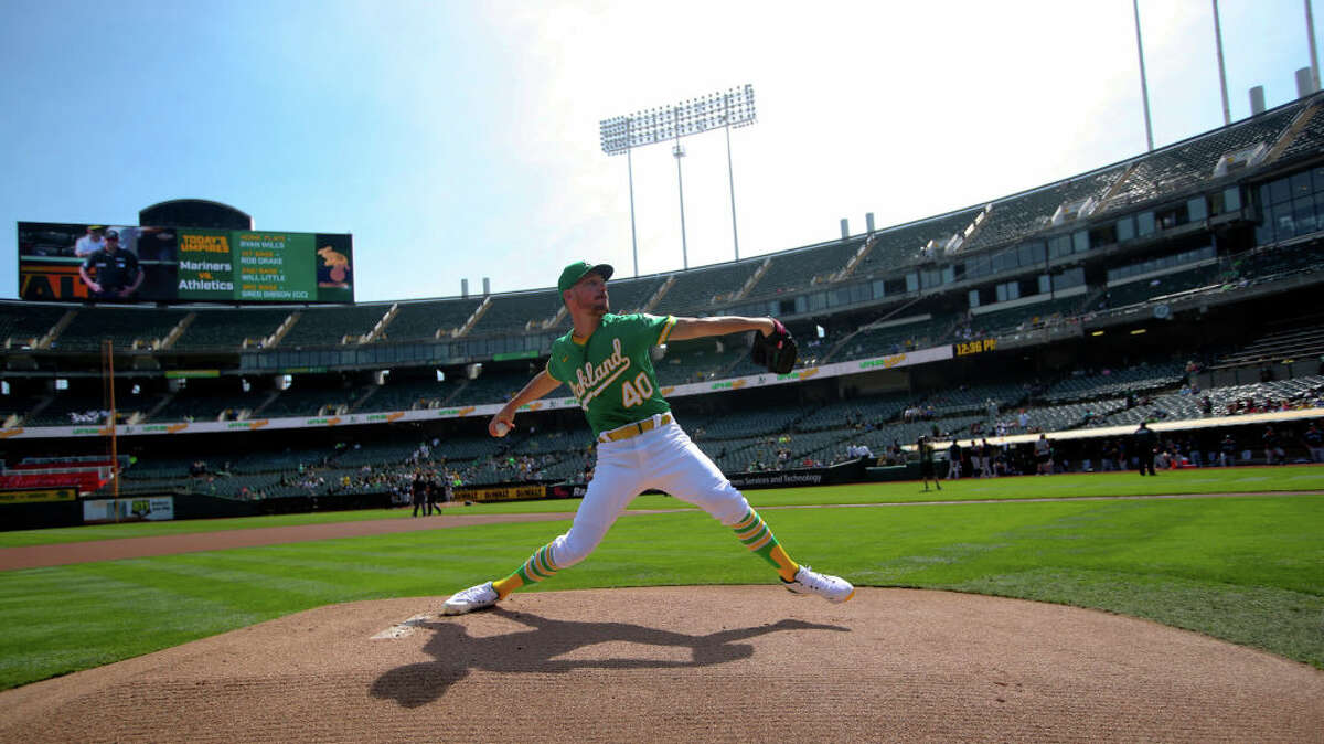 Chris Bassitt of the Oakland Athletics warms up from the mound before the game against the Seattle Mariners at RingCentral Coliseum on Sept. 23, 2021, in Oakland, Calif. 