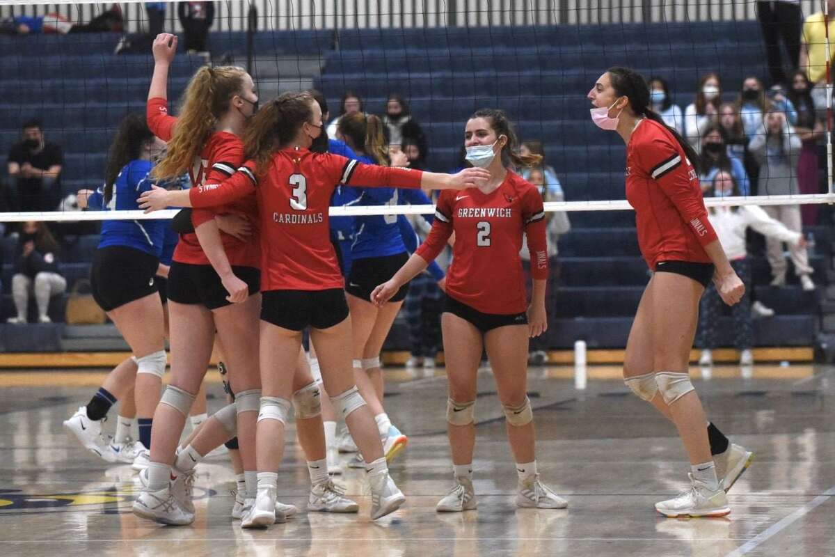 The Greenwich volleyball team celebrates a point during the Class LL volleyball final against Ludlowe on Nov. 20, in East Haven. The Cardinals were 26-1, won FCIAC and Class LL titles, and were the top-ranked team throughout the season,
